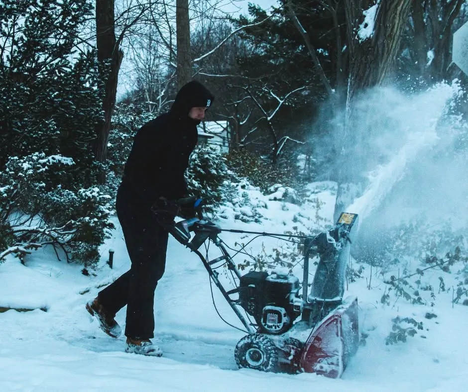 Greenworks snow equipment clearing a residential driveway